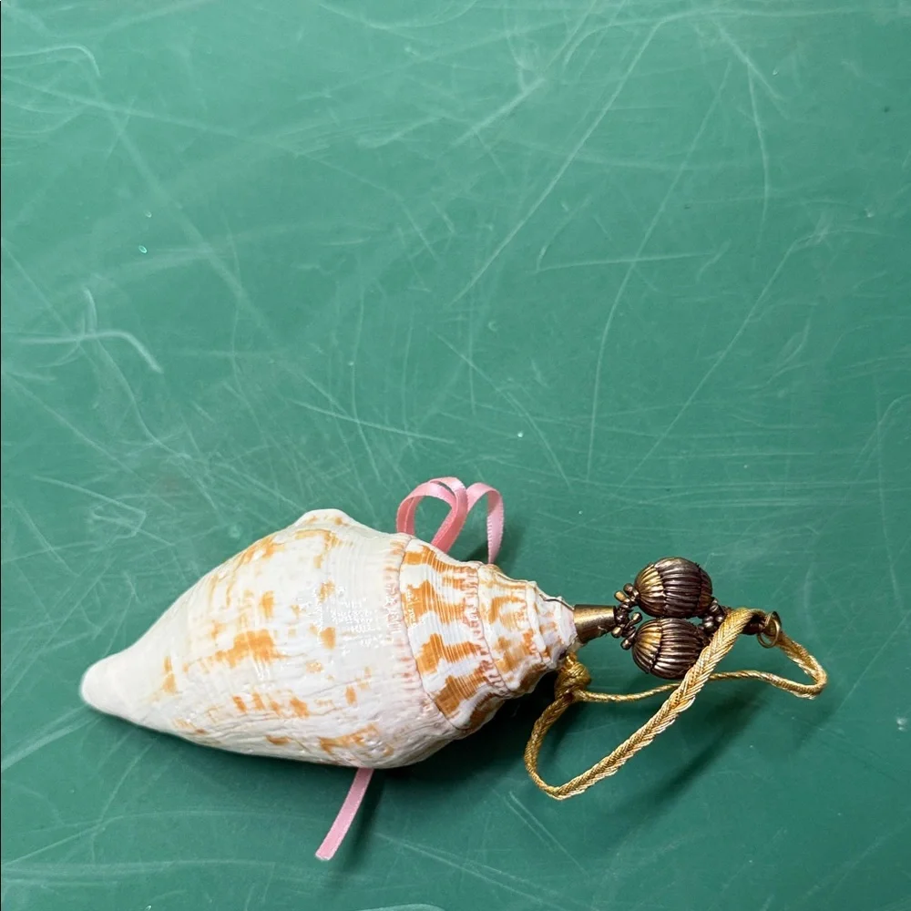 Elegant Shell Ornament with Pink and Green Accents